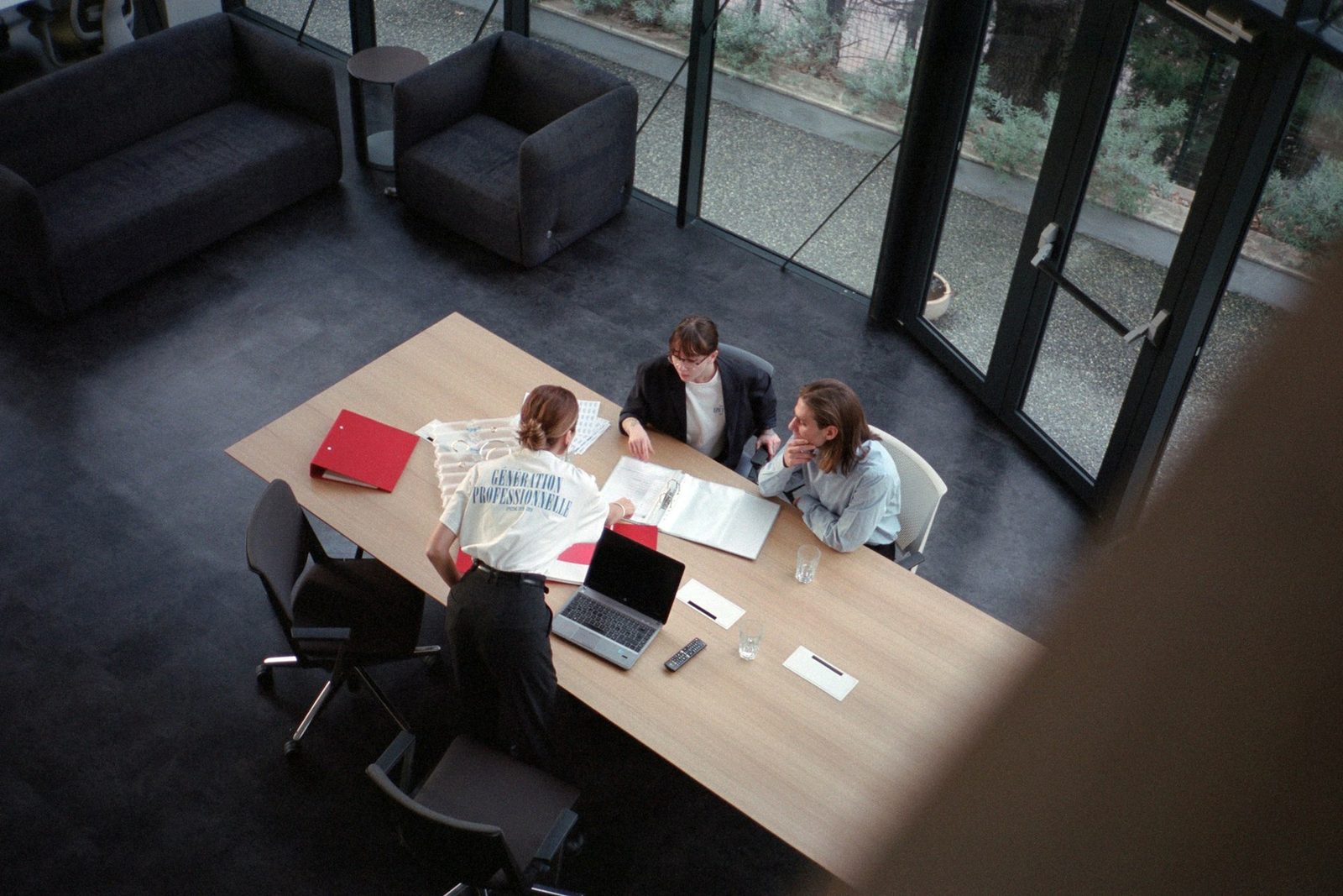 Two models at a meeting table seen from above