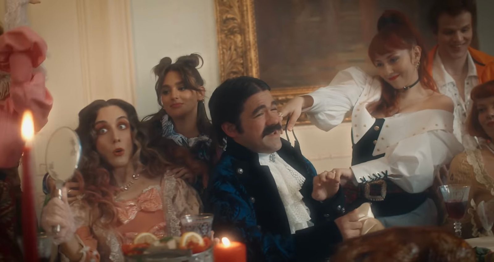 Guests in period costume at the banquet table